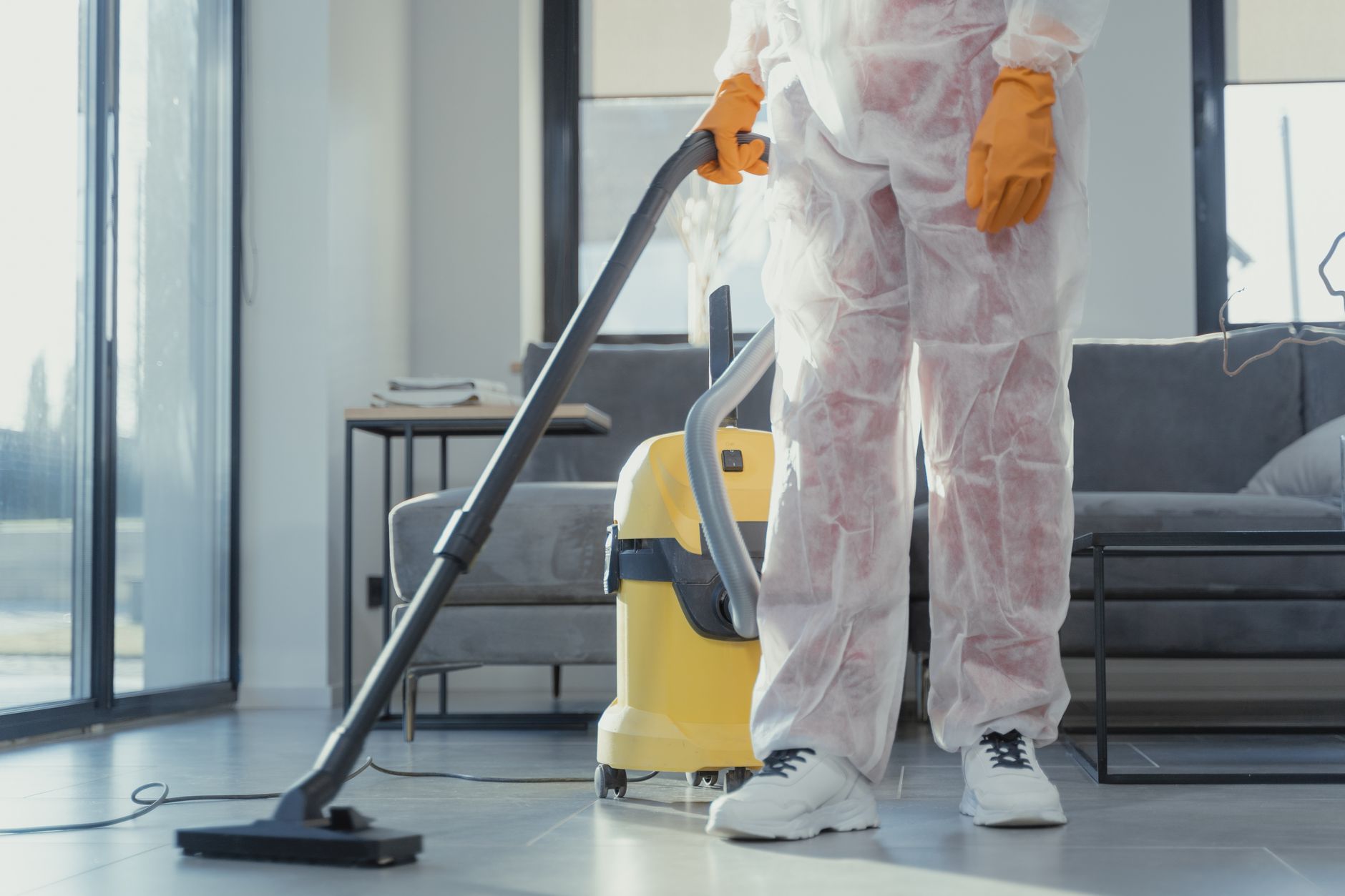 A Goldthwaite homeowner shaking hands with a Coastal Pro Mold Removal technician after a successful mold remediation, showing satisfaction.